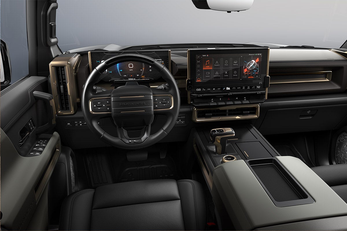 Folsom Buick GMC FOLSOM CA - Modern dashboard interior of GMC Hummer EV featuring digital instrument cluster, large infotainment touchscreen, and premium black leather cockpit
